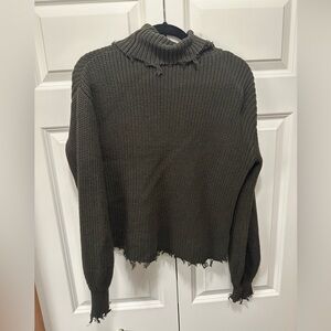 Green turtleneck sweater.